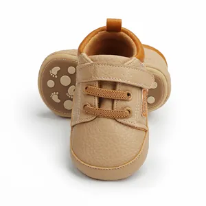 Detailed macro view of beige baby walker shoes featuring a soft non-slip sole.