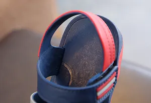 Close-up of boys' navy blue and red summer sandals showing durable strap and heel detail