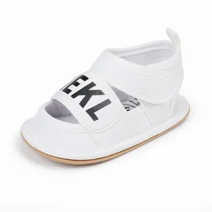 White canvas baby walker sandal with bold black EKL letter print and Velcro strap