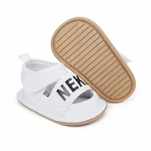 Detail view of white baby summer sandals showing the non-slip textured rubber sole
