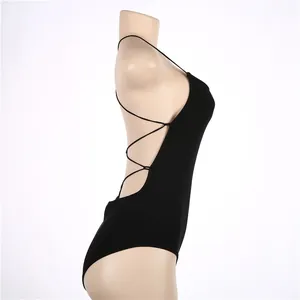Side view of sexy black backless bodysuit with criss-cross straps on mannequin