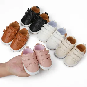 Collection of multi-colored baby walking shoes with soft leather and velcro straps.