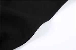 Macro view showing the high-quality stitching and texture of the black bodysuit fabric