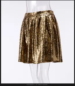 Detailed macro view of a glamorous gold sequin mini skirt with shimmering textures