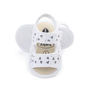 White baby pre-walker sandals with soft non-slip sole and cute triangle patterns
