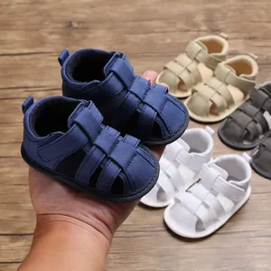 Close-up of soft-soled baby boy closed-toe sandals in multiple versatile colors.