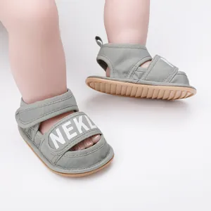 Close-up of green baby pre-walker sandals with Velcro straps for infants 0-1 years