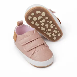 Close-up of pink baby walking shoes with anti-slip soles and Velcro straps