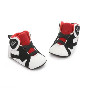 Detailed view of red and black baby basketball shoes with soft non-slip soles