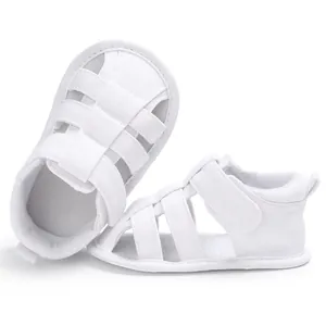 White baby boy closed-toe sandals with soft non-slip soles for pre-walkers 0-1 year.