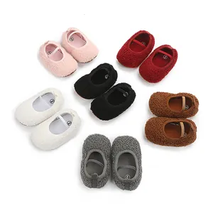 Detail view of plush baby walking shoes in multiple colors arranged in a circle