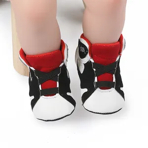 Detail shot of red, white, and black baby basketball shoes for infants 0-1 year old