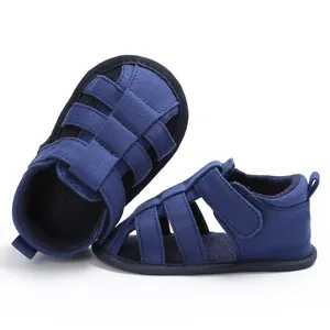 Detail view showing navy blue closed-toe walking sandals for baby boys with soft soles