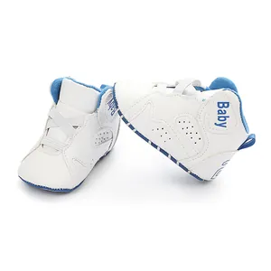 Close-up showing the detail of blue and white soft-sole baby basketball walking shoes.