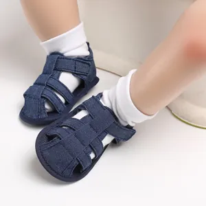 Close-up of dark blue denim baby boy sandals with closed toe design and soft anti-slip sole