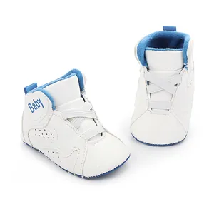 Detailed view of white and blue infant baby basketball shoes with soft anti-slip soles
