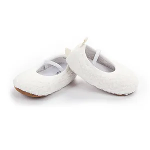 Close-up detail showing the soft white sherpa texture of these baby walking shoes