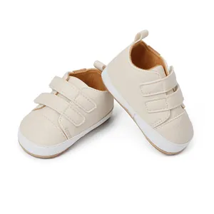 Detail of cream baby walking shoes with dual hook-and-loop straps and soft sole