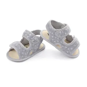 Grey baby toddler sandals featuring white triangle pattern and adjustable Velcro straps