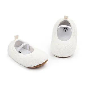 Detailed view of soft white fuzzy sherpa baby walking shoes with comfortable elastic strap