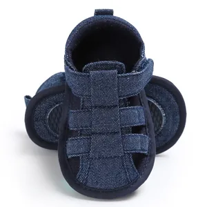 Detail of baby boy closed-toe denim sandals with soft non-slip soles for walkers