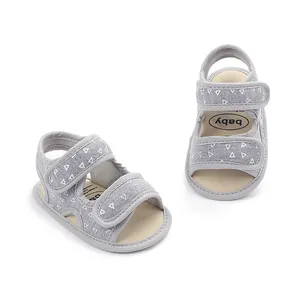 Detail view of breathable grey baby summer sandals with white triangle print and soft sole