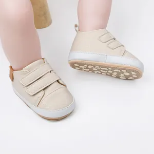 Detailed view of beige baby walking shoes with non-slip soles and adjustable straps.