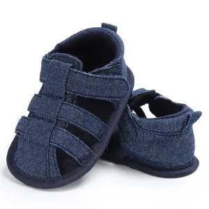 Detailed view of navy blue denim baby boy closed-toe sandals with non-slip soft soles.