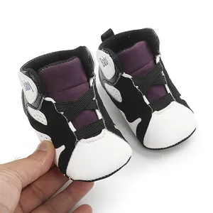 Macro view of baby basketball walking shoes with soft soles and purple black accents