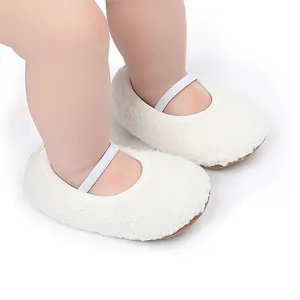 Macro view of white fuzzy fleece baby Mary Jane shoes featuring a soft elastic strap.