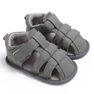 Close-up of grey baby boy closed-toe sandals with soft non-slip soles for toddlers