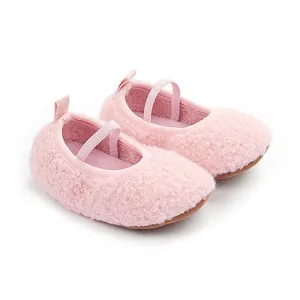 Detailed view of pink fuzzy baby walker shoes with comfortable soft non-slip soles