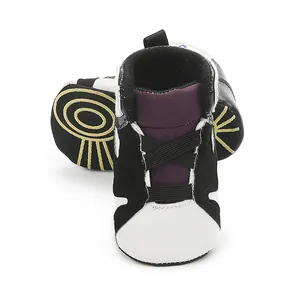 Detailed view of black and white baby basketball shoes with soft anti-slip soles