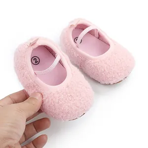 Soft pink fuzzy sherpa baby Mary Jane walking shoes with flexible elastic strap.