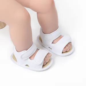 Close-up of white breathable mesh baby walking sandals with hook-and-loop straps