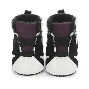 Front view detail of stylish infant high-top basketball shoes with black white and purple colorway