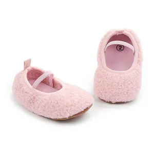 Close-up of soft pink fleece baby walking shoes featuring an elastic strap detail