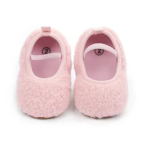 Soft pink fuzzy baby walking shoes with comfortable elastic strap and plush texture detail