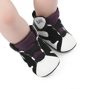 Close-up of soft-sole non-slip baby sneakers designed in a classic basketball shoe style