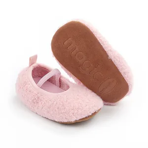 Detailed view of pink plush baby prewalker shoes with non-slip sole and elastic strap