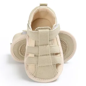 Detailed front view of beige canvas baby walking sandals featuring soft anti-slip soles
