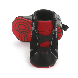 Detailed view of baby basketball pre-walker shoes featuring red and black soft soles