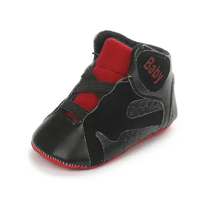 Detailed view of high-top black and red baby pre-walker shoe with soft non-slip sole