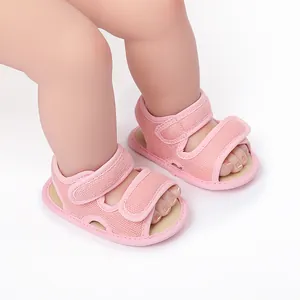 Macro view of pink breathable mesh baby walking sandals with secure velcro straps