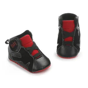 Close-up detail of black and red baby basketball walking shoes with soft non-slip soles