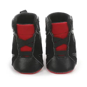 Detailed front view of black and red infant basketball shoes with soft anti-slip soles for babies