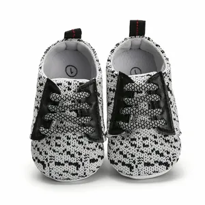 Detailed view of breathable knit infant walking shoes with non-slip rubber soles