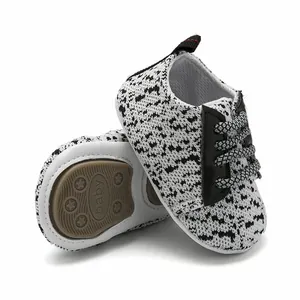 Detail of baby walking shoes with non-slip rubber sole and breathable knit upper