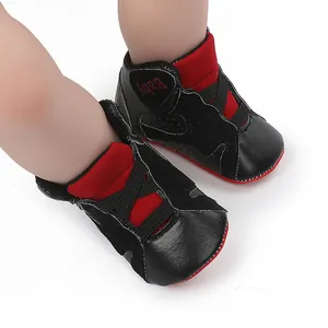 Close-up of black and red infant basketball walking shoes with soft soles