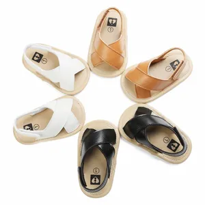 Top-down view of cross-strap baby walking sandals in white, tan, and black leather colors.